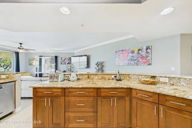 a spacious bathroom with a granite countertop sink mirror and bathtub
