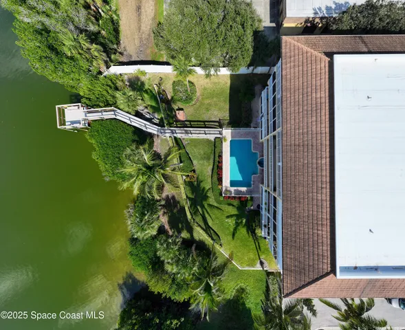 a view of a hallway with painting on the wall