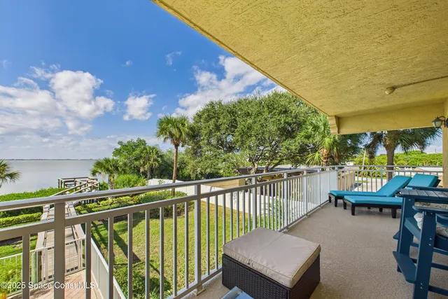 a view of a swimming pool with a patio and a garden