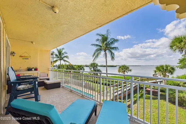 a view of a palm trees in front of a house