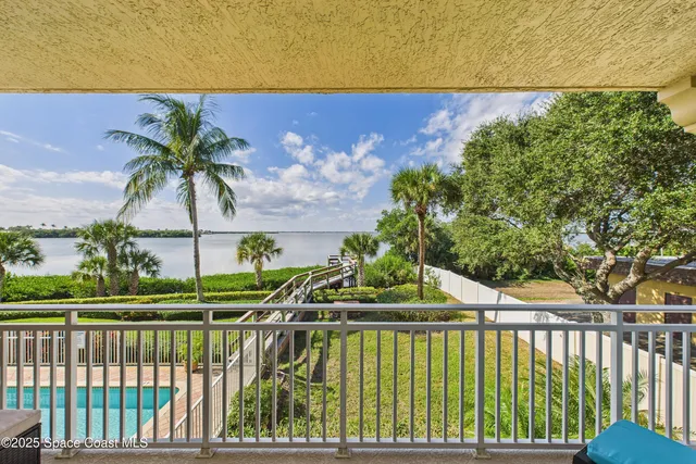 an aerial view of a house with a lake view