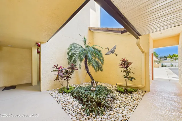 a kitchen with stainless steel appliances granite countertop a sink a stove cabinets counter space and a window