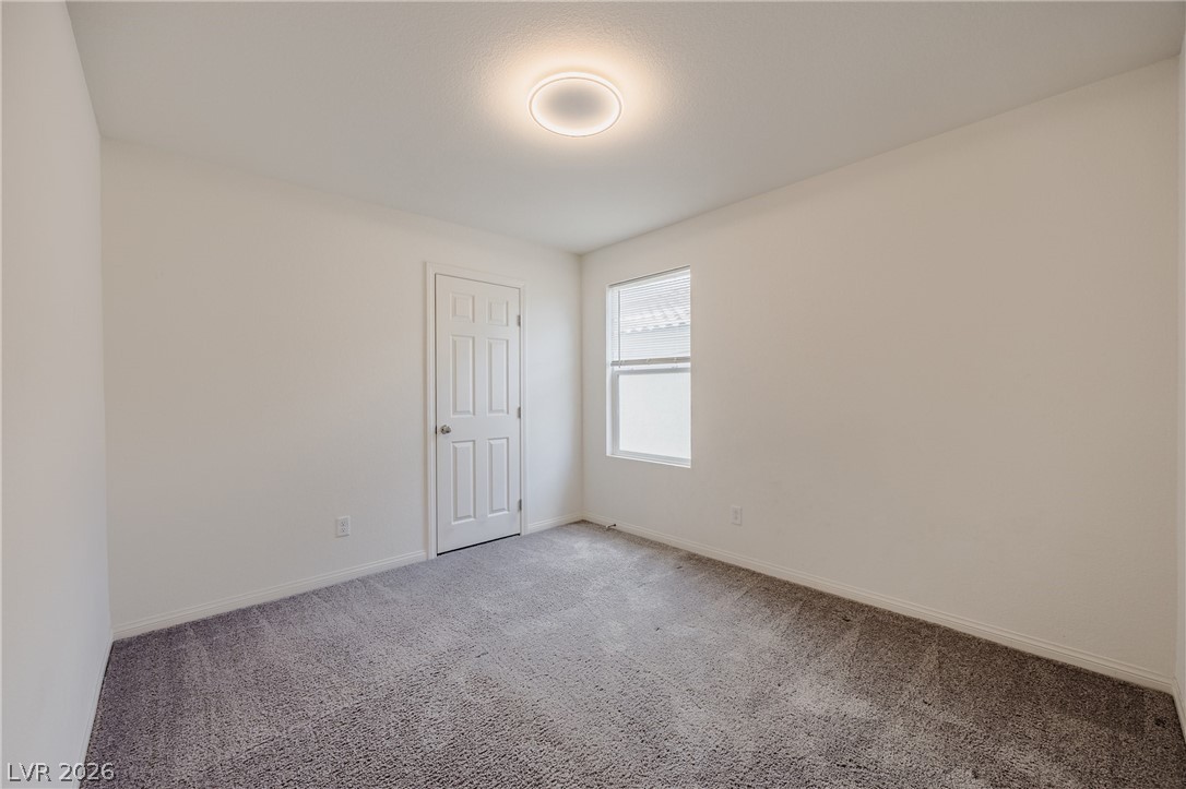 5927 Coja Street Las Vegas, NV 89113 - Photo 19 of 32 Unfurnished room featuring light carpet and baseboards