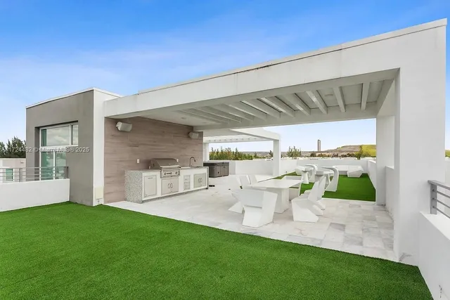a view of a house with porch and garden