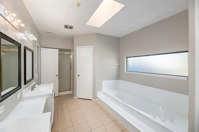 a bathroom with a bathtub and a sink