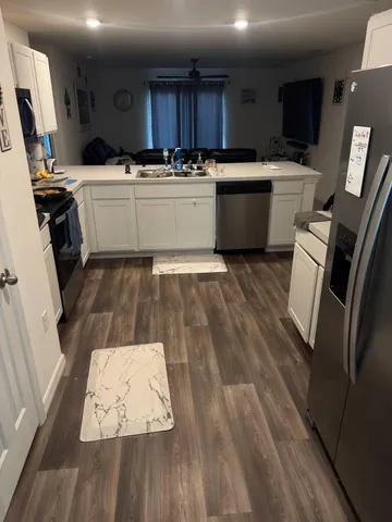a kitchen with a sink and a stove top oven