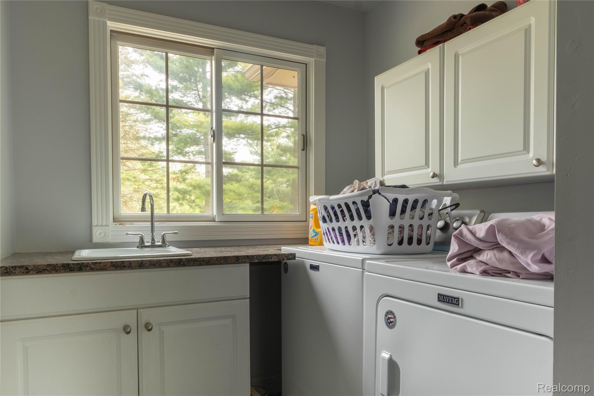 60475 9 Mile Road South Lyon, MI 48178 - Photo 27 of 44 Upstairs Laundry Room