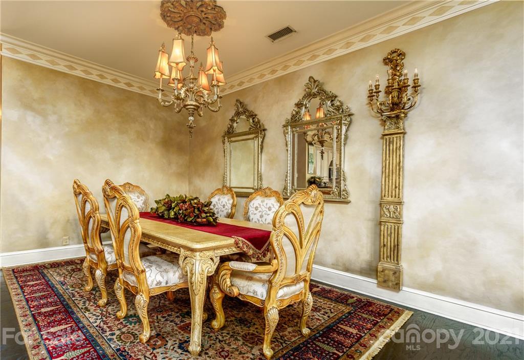 2823 Providence Road, Unit 235 Charlotte, NC 28211 - Photo 12 of 37 a view of a dining room with furniture and chandelier