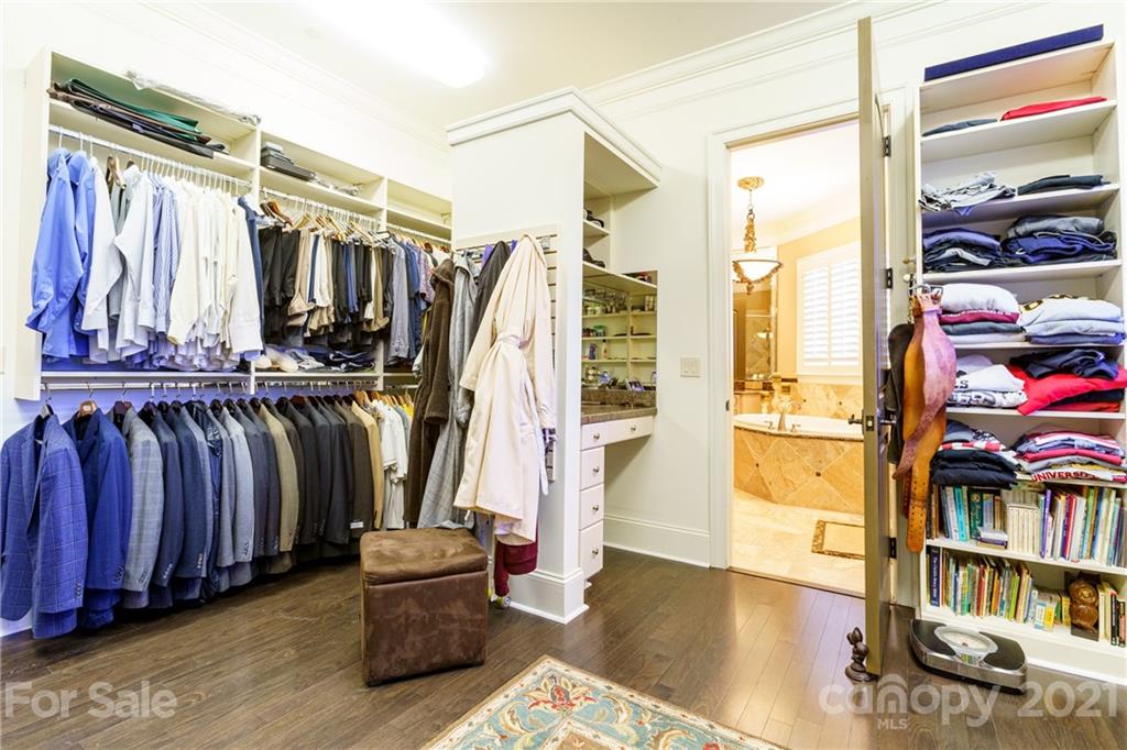 2823 Providence Road, Unit 235 Charlotte, NC 28211 - Photo 18 of 37 a view of walk in closet with clothes and shoes