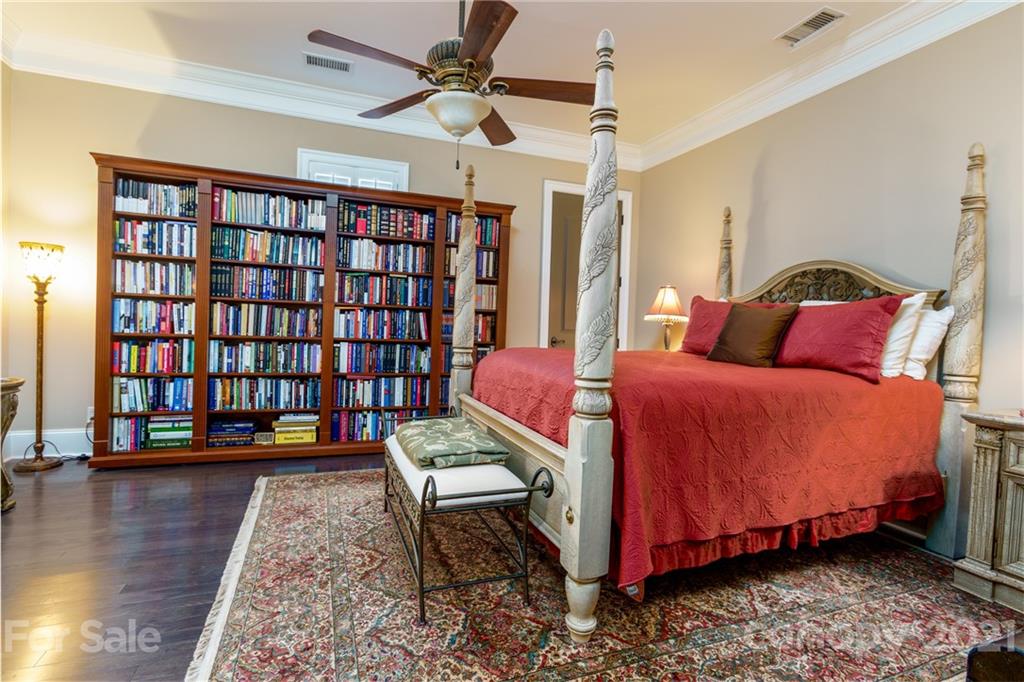 2823 Providence Road, Unit 235 Charlotte, NC 28211 - Photo 21 of 37 a bedroom with a bed and a book shelf