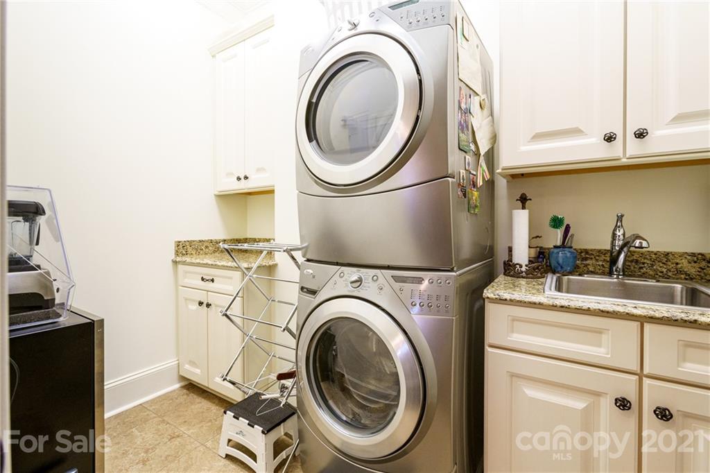 2823 Providence Road, Unit 235 Charlotte, NC 28211 - Photo 23 of 37 a utility room with dryer and washer