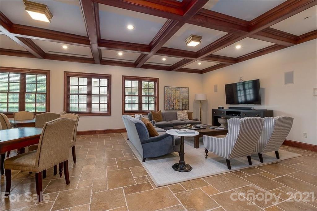 2823 Providence Road, Unit 235 Charlotte, NC 28211 - Photo 28 of 37 a living room with patio furniture and a flat screen tv