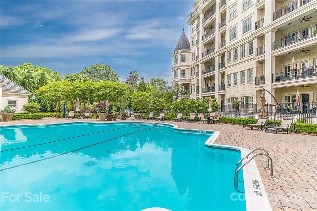 2823 Providence Road, Unit 235 Charlotte, NC 28211 - Photo 32 of 37 a swimming pool with outdoor seating and yard