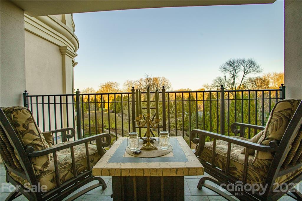 2823 Providence Road, Unit 235 Charlotte, NC 28211 - Photo 6 of 37 a view of a balcony with wooden floor
