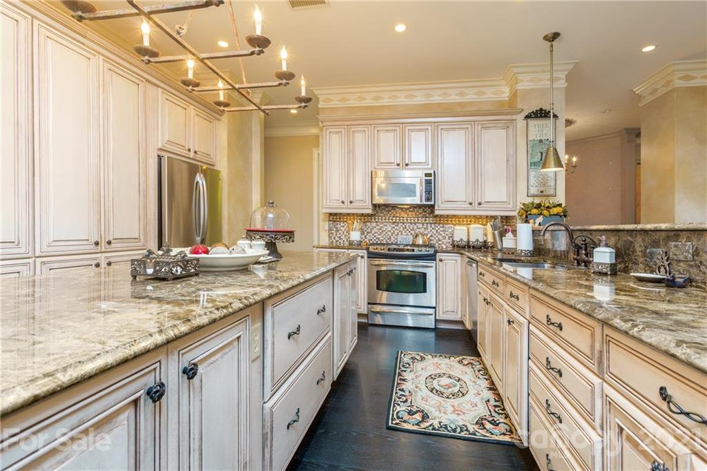 2823 Providence Road, Unit 235 Charlotte, NC 28211 - Photo 10 of 37 a kitchen with stainless steel appliances granite countertop a sink stove and cabinets