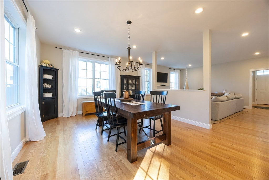 4 Sheppards Way Ipswich, MA 01938 - Photo 15 of 37 a view of a dining room and livingroom with furniture wooden floor a chandelier