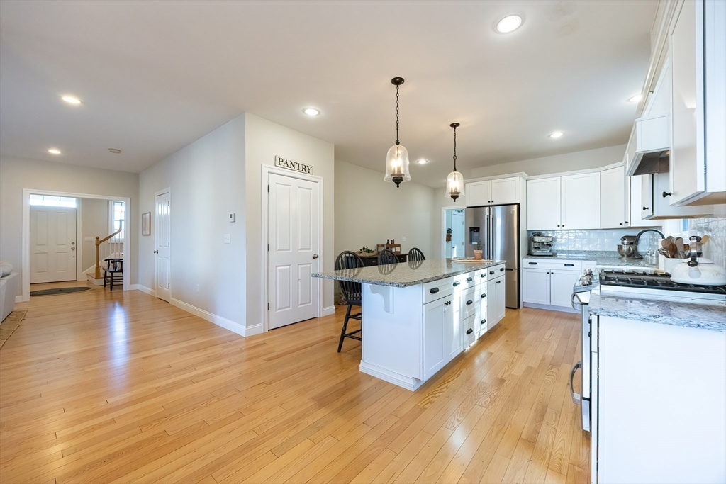 4 Sheppards Way Ipswich, MA 01938 - Photo 19 of 37 a large kitchen with granite countertop a large counter top a sink stainless steel appliances and cabinets