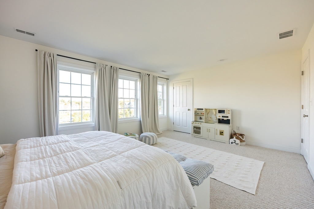 4 Sheppards Way Ipswich, MA 01938 - Photo 27 of 37 a bed sitting in a spacious bedroom next to a window