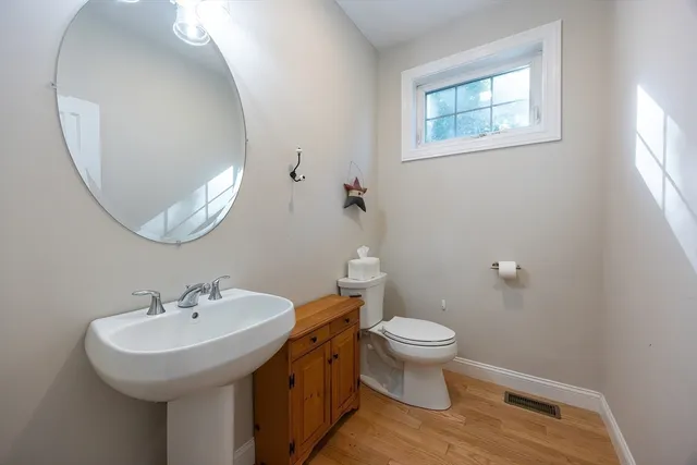 a bathroom with a granite countertop sink a mirror and a