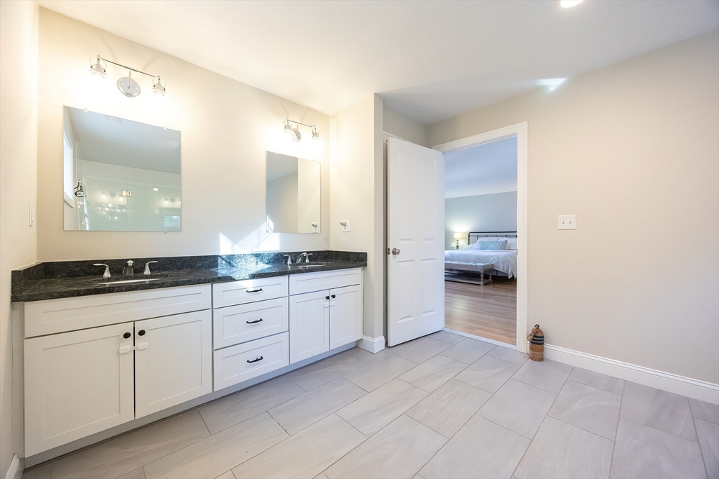 4 Sheppards Way Ipswich, MA 01938 - Photo 33 of 37 a spacious bathroom with a granite countertop sink mirror and toilet