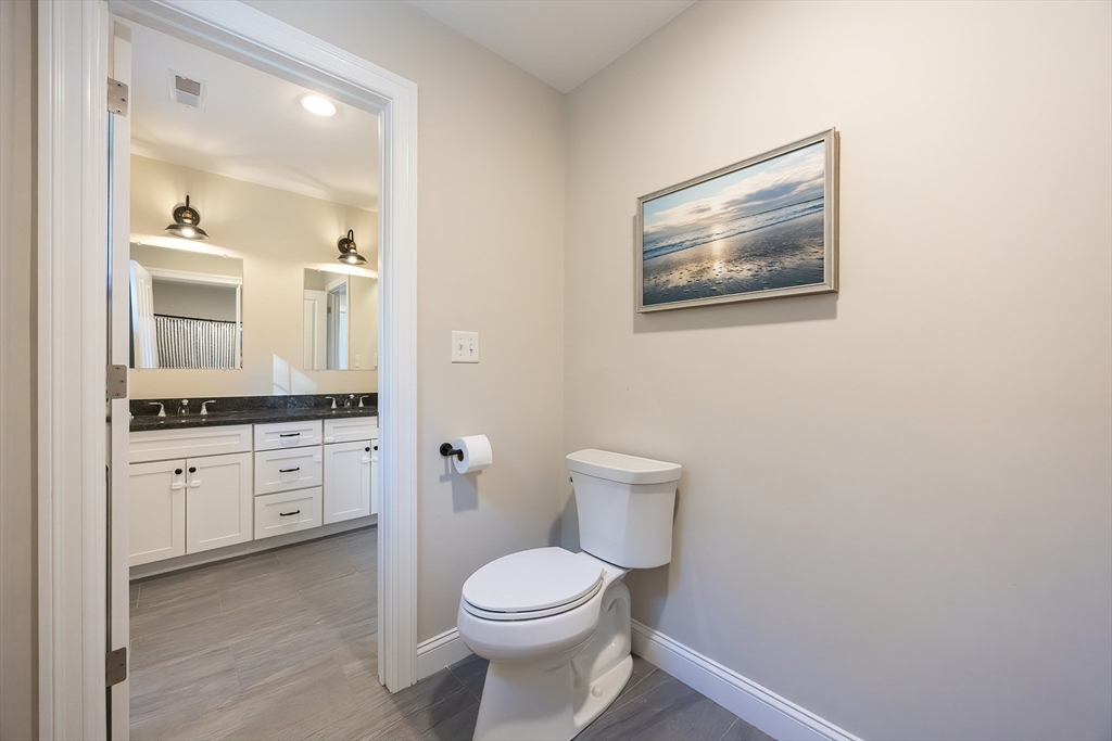 4 Sheppards Way Ipswich, MA 01938 - Photo 35 of 37 a bathroom with a toilet a sink and mirror