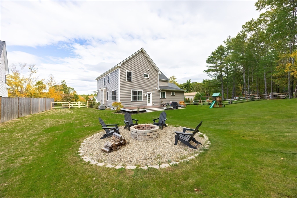 4 Sheppards Way Ipswich, MA 01938 - Photo 7 of 37 a view of a house with backyard sitting area and garden