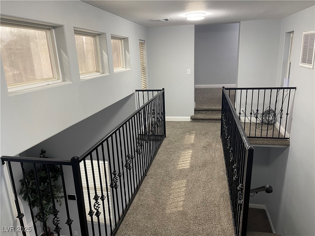 6480 West Oquendo Road Las Vegas, NV 89118 - Photo 31 of 51 Hallway upstairs featuring carpet and an upstairs landing