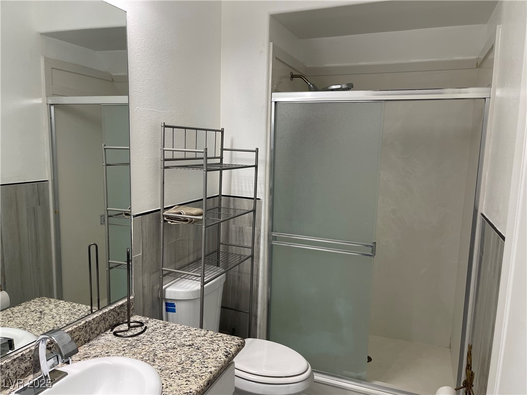 6480 West Oquendo Road Las Vegas, NV 89118 - Photo 33 of 51 Full bath featuring a shower stall and vanity