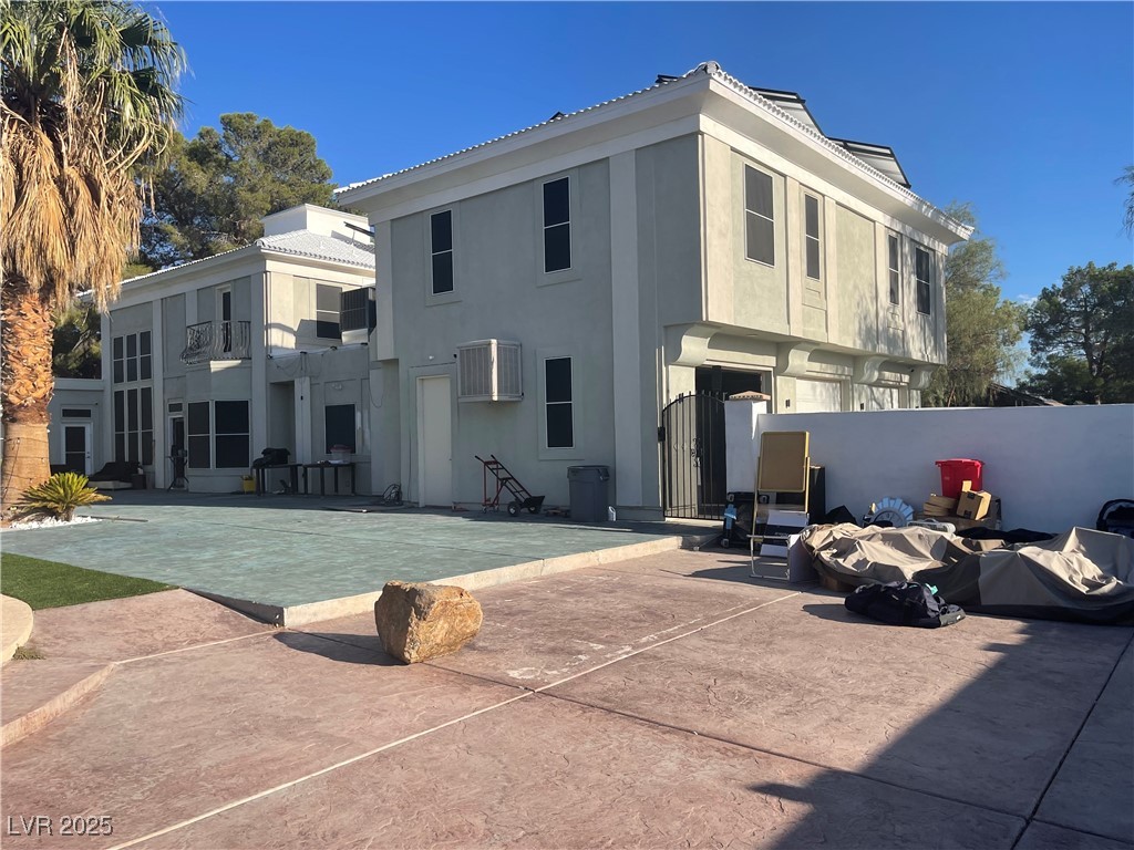 6480 West Oquendo Road Las Vegas, NV 89118 - Photo 46 of 51 Rear view of house with stucco siding