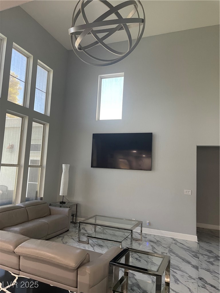 6480 West Oquendo Road Las Vegas, NV 89118 - Photo 6 of 51 Living room with marble finish flooring and baseboards