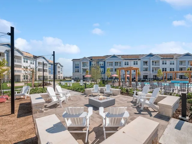 a view of a patio with couches table and chairs