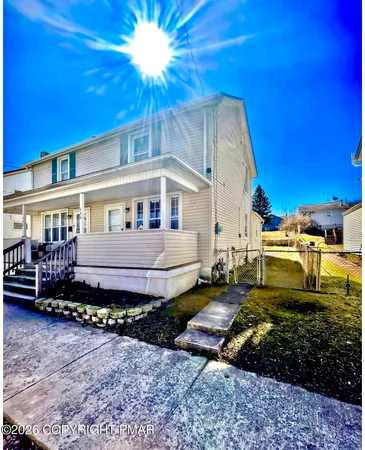 a house view with a garden space