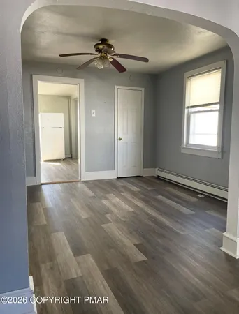 a view of an empty room with a window