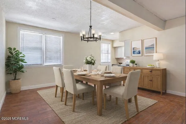 a view of a dining room with furniture and window