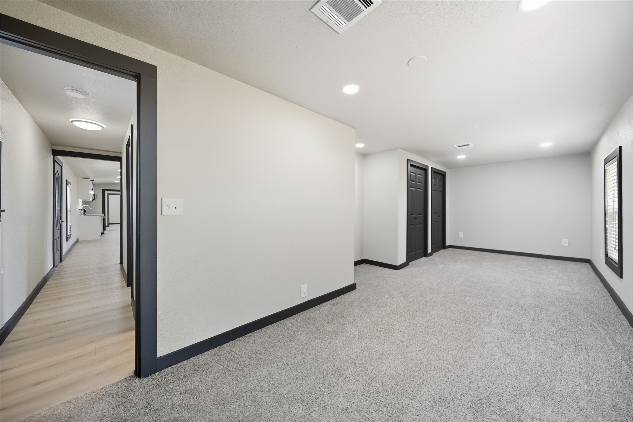 9137 Conner Road Washington, TX 77880 - Photo 42 of 49 a view of a hallway with wooden floor and staircase