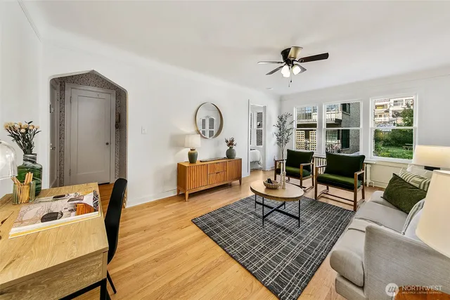 a living room with furniture rug and window