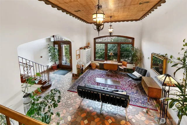 a living room with furniture fireplace and a chandelier