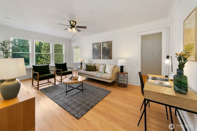 a living room with furniture and a large window
