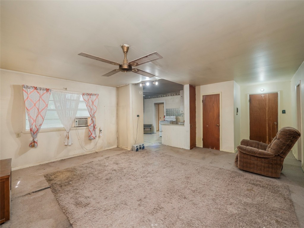 3104 South Main Street Taylor, TX 76574 - Photo 10 of 22 a view of a livingroom with a ceiling fan and window