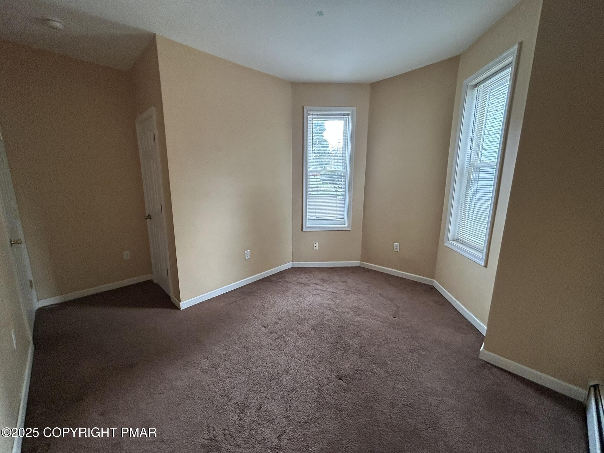 175 Prospect Street, Unit 1771 East Stroudsburg, PA 18301 - Photo 12 of 13 an empty room with windows