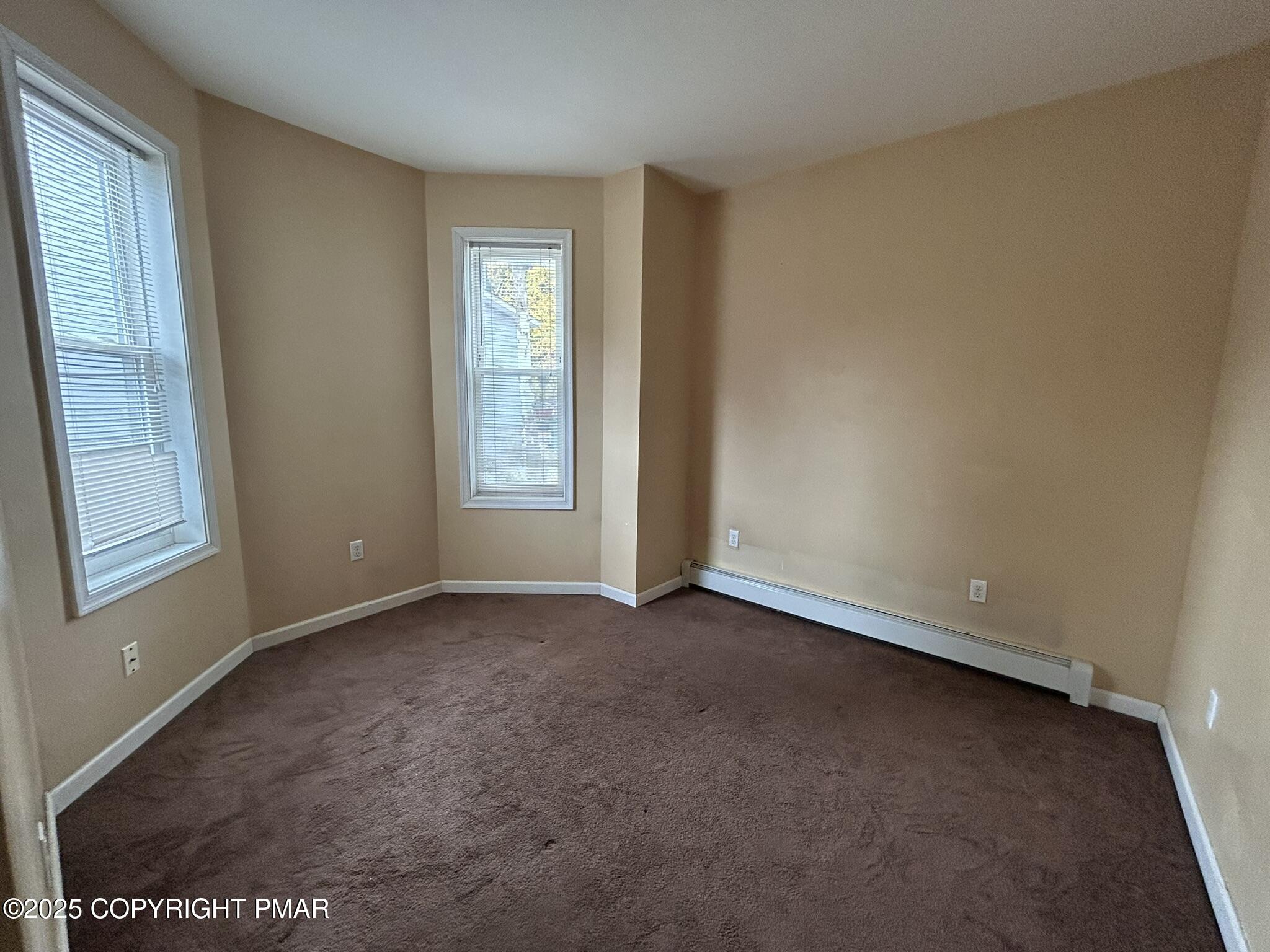 175 Prospect Street, Unit 1771 East Stroudsburg, PA 18301 - Photo 13 of 13 an empty room with windows