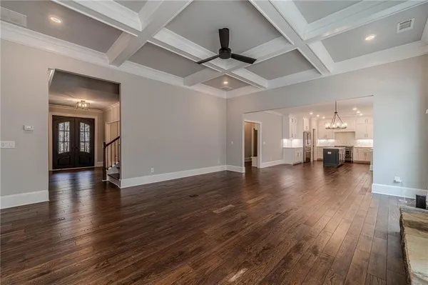 a kitchen with a stove and white cabinets