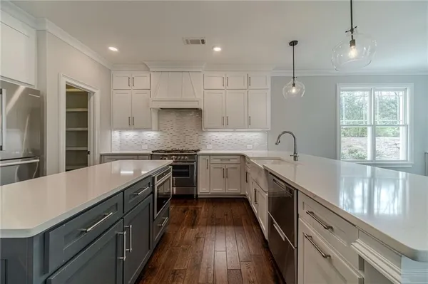 a spacious bathroom with a shower sink and mirror