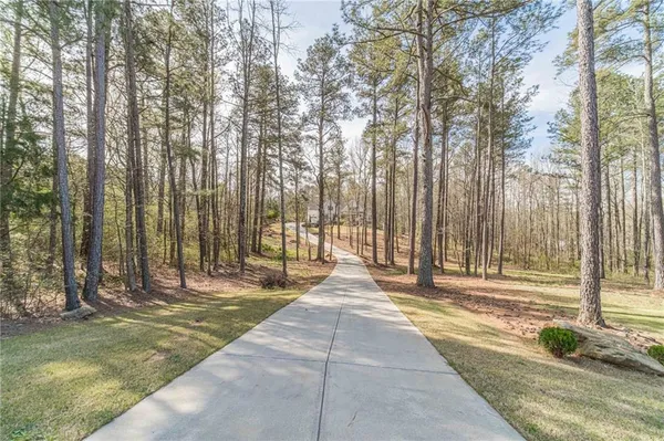 a view of a room with window wooden floor and a chandelier