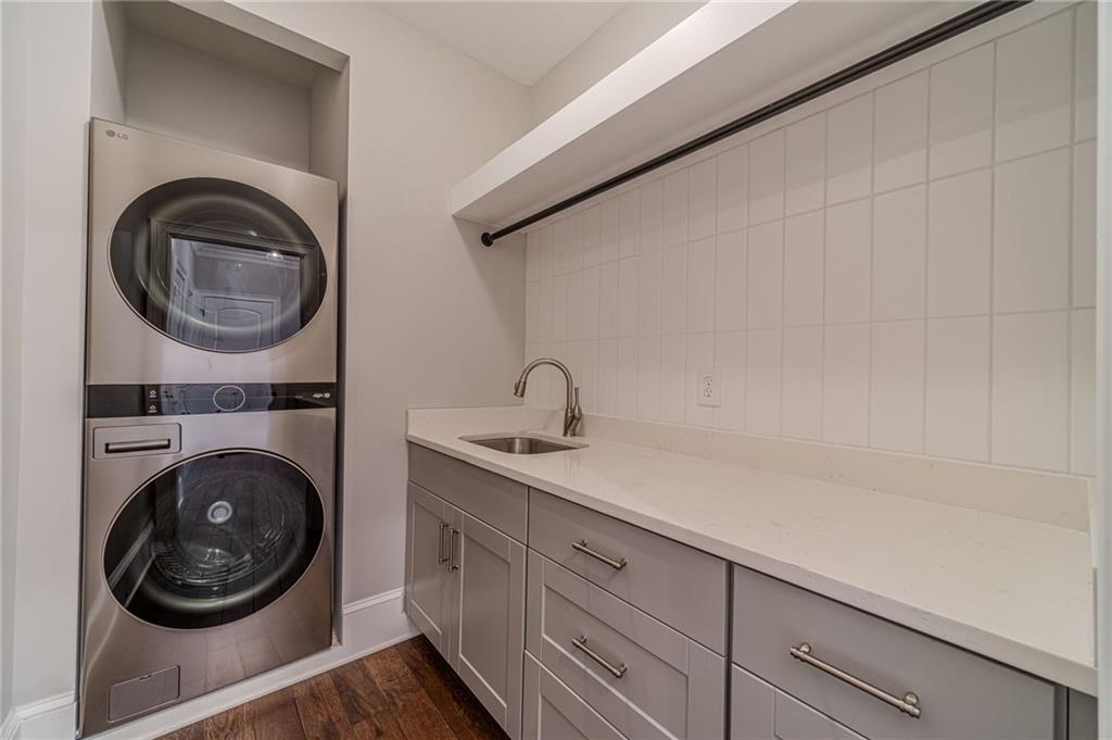 4720 Bold Springs Road Monroe, GA 30656 - Photo 29 of 83 a close view of a utility room with sink dryer and washer