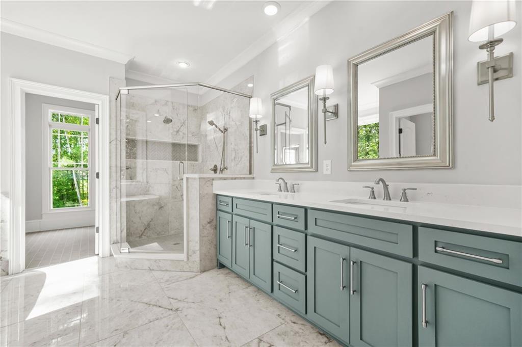 4720 Bold Springs Road Monroe, GA 30656 - Photo 33 of 83 a spacious bathroom with a shower sink and mirror