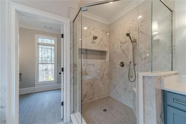 a bathroom with a granite countertop toilet a sink and a bathtub
