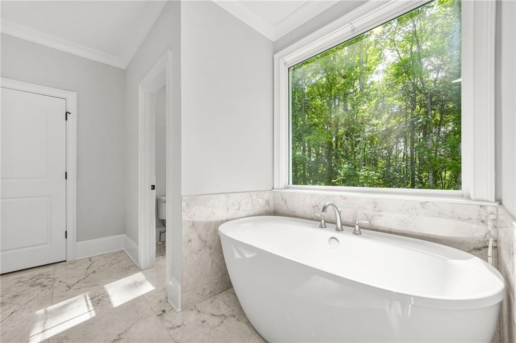 4720 Bold Springs Road Monroe, GA 30656 - Photo 35 of 83 a bathroom with a bathtub and shower