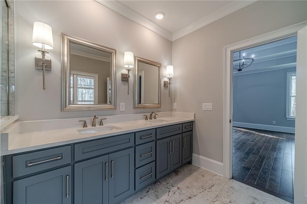 4720 Bold Springs Road Monroe, GA 30656 - Photo 36 of 83 a bathroom with a double vanity sink and a mirror