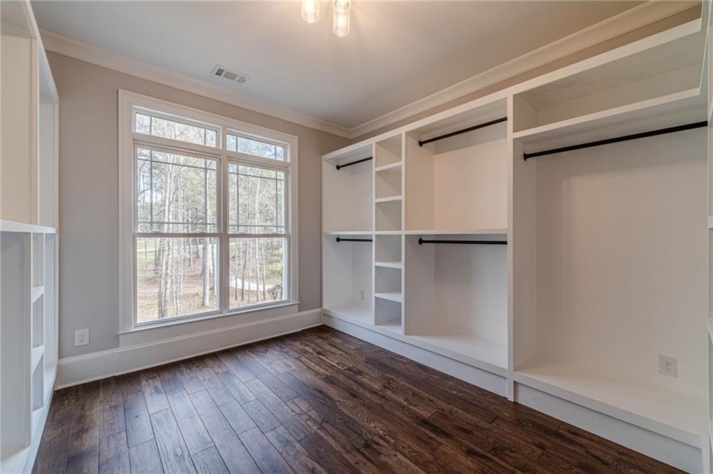 4720 Bold Springs Road Monroe, GA 30656 - Photo 40 of 83 a view of an empty room with wooden floor and a window